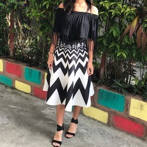Off-shoulder top and B/W skirt